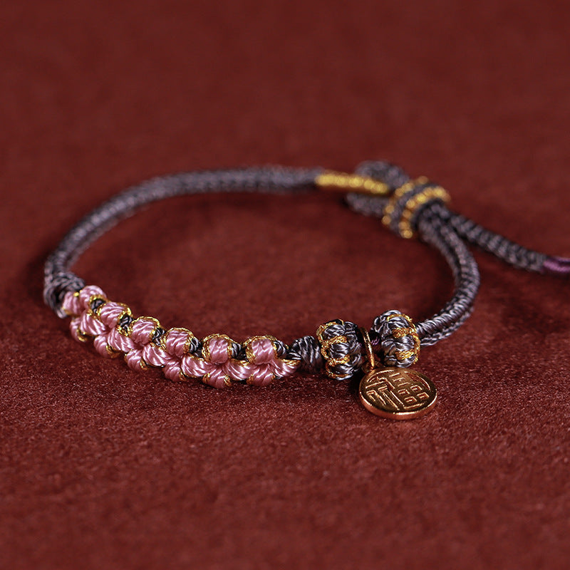 Rotes gewebtes buddhistisches Perlenarmband für Glück und Frieden