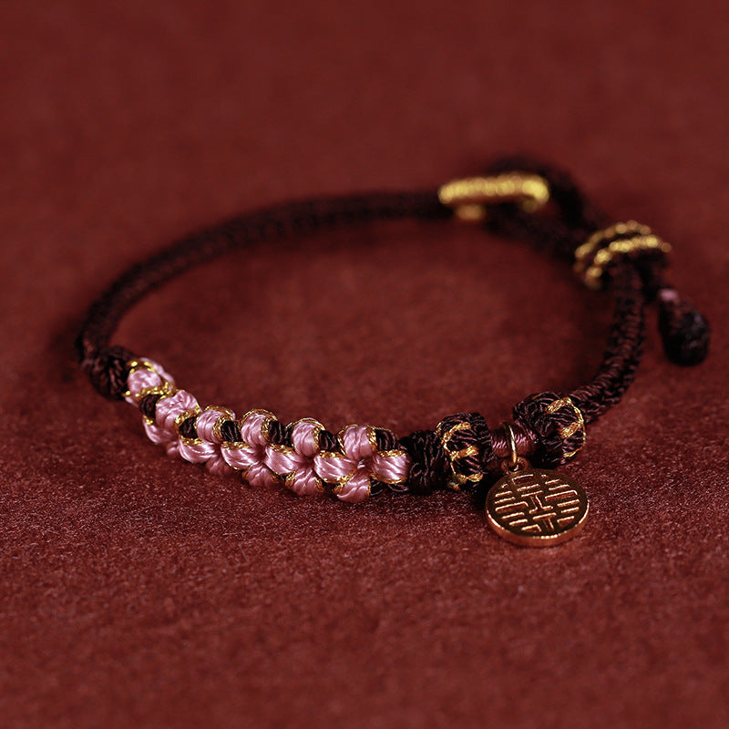 Rotes gewebtes buddhistisches Perlenarmband für Glück und Frieden