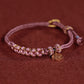 Rotes gewebtes buddhistisches Perlenarmband für Glück und Frieden