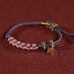 Rotes gewebtes buddhistisches Perlenarmband für Glück und Frieden