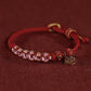 Rotes gewebtes buddhistisches Perlenarmband für Glück und Frieden